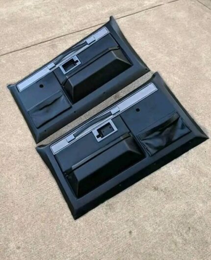 door panels for a 1973-1987 Chevrolet/GMC Square Body truck. These panels are interior components that cover the inside of the vehicle's doors. 