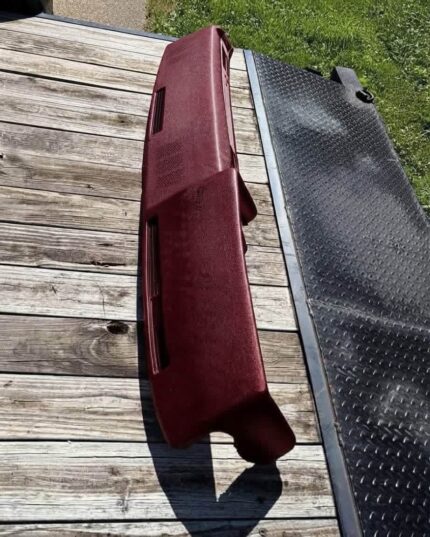 Brand new burgundy dash pad in the box - never installed. No cracks, no warping, no fade.