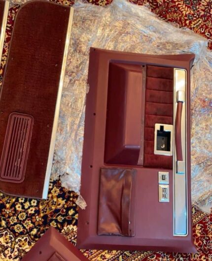 Brand new burgundy door panels + kick panels in the box - never installed. No cracks, no fading, clean.